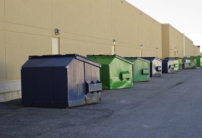 multiple construction dumpsters at a worksite holding various types of debris in Partlow, VA